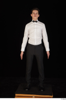  Jamie black shoes black trousers bow tie dressed standing uniform waiter uniform white shirt whole body 0001.jpg